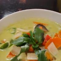 Green Curry · Medium. Simmered in a traditional green curry coconut broth with bamboo shoots and fresh bas...