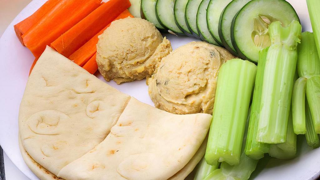Hummus Platter · Choice of jalapeno or regular hummus served with an assortment of vegetables and pita bread.