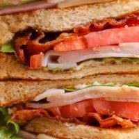 Blt Sandwich · Triple-decker sandwich with thick center-cut bacon, lettuce, tomato and mayonnaise. Served o...