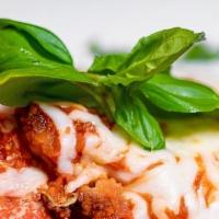 Pollo Parmigiana · Breaded chicken, mozzarella, Parmesan & pomodoro sauce.