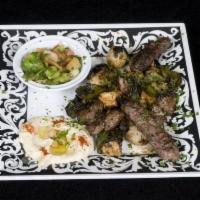 Mixed Grill  · Combination of Lamb,  Chicken and Kufta Kabab.