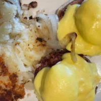 Eggs Benedict · Two halves of a toasted english muffin, topped with canadian bacon, poached eggs and holland...