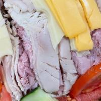 Chef'S Salad · Turkey, ham, American and swiss cheese, with sliced roast beef and tomato on a house salad w...