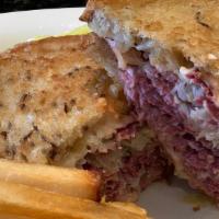 Reuben Sandwich · Corned beef or turkey, served on rye with melted swiss cheese and sauerkraut