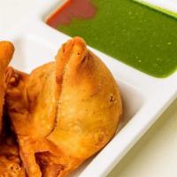 Samosa · A special dough pastry stuffed with potatoes and peas with 5 spice flavors.