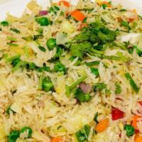 Vegetable Fried Rice · Rice fried with vegetables and Chinese sauces.