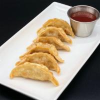 Pot Stickers · Six pieces fried chicken potstickers/gyoza/dumplings with a side of sweet & sour sauce