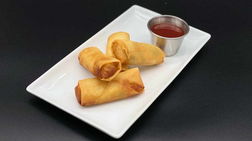 Spring Rolls · Four pieces fried vegetable spring rolls with a side of sweet & sour sauce
