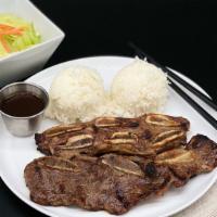 Kalbi Short Ribs · Three pieces Korean style marinated short ribs and rice. Served with side lettuce salad (pop...