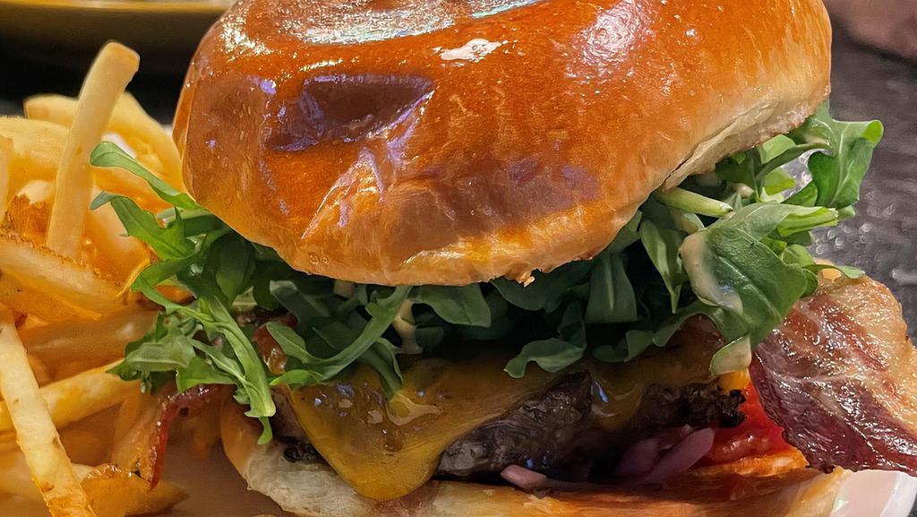 Red Bird Burger · 7 oz. Angus Burger, Cheddar Cheese, Tomato-Bacon Jam, Arugula, Pickled Onions, Bacon, Red Bird Sauce. Add an Extra Patty for an additional charge.