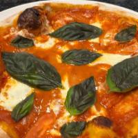 Margherita Pizza · Vegetarian. Tomatoes, Fresh Mozzarella, Basil.