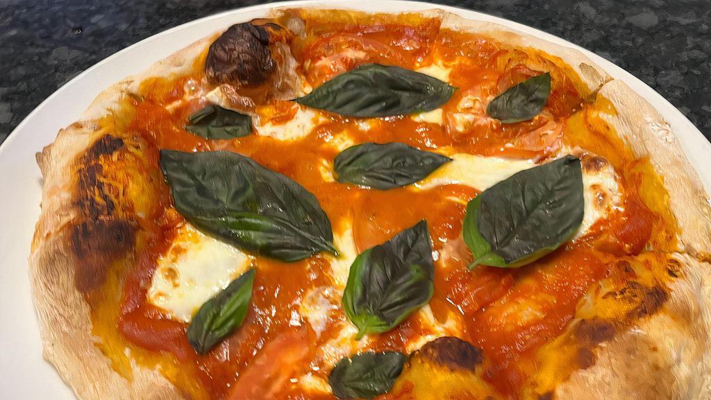 Margherita Pizza · Vegetarian. Tomatoes, Fresh Mozzarella, Basil.
