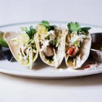 Grilled Mahi Tacos · Tomatillo salsa, avocado, jicama slaw.