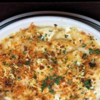 Lobster Mac & Cheese · Fontina, American & Grana Cheese. Topped With Buttered Breadcrumbs