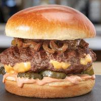 Juicy Lucy · hot, melted cheese stuffed in an all-natural beef patty • caramelized onions • pickles • tan...