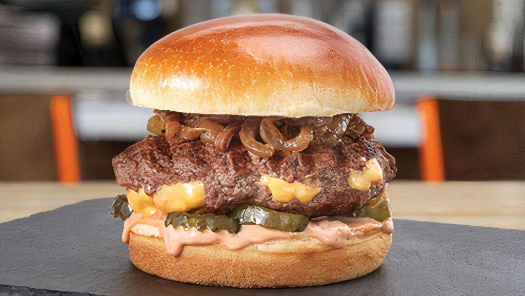 Juicy Lucy · hot, melted cheese stuffed in an all-natural beef patty • caramelized onions • pickles • tangy lucy sauce •  toasted brioche bun