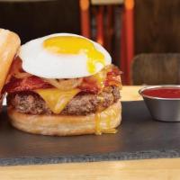 Glaze Of Glory Donut Burger · All-natural angus beef, cheddar cheese, sweet and spicy bacon, caramelized onions, and a fri...