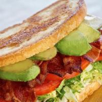 L.T. & A. · applewood smoked bacon • lettuce blend • tomatoes • avocado • garlic aioli • griddled sourdo...
