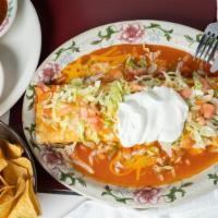 Super Burrito · Soft flour tortilla filled with rice, beans and your choice of chicken or beef. Garnished wi...