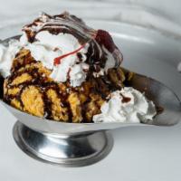 Deep Fried Ice Cream · Ice Cream formed into a ball frozen solid, then rolled in a special breadind and deep fried ...