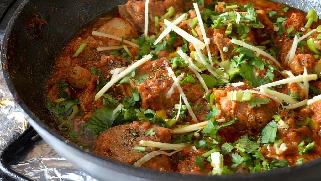Goat Karahi · Gluten free. Succulent and juicy meat cooked slow in a karahi or wok along with tomatoes, ginger-garlic, black pepper.