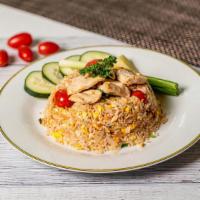 Thai Fried Rice · Chef's special fried rice with egg. Scallions, tomatoes, and onion.