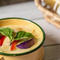 Green Curry · Traditional style green curry with coconut milk, bamboo shoots, eggplant, basil, and bell pe...
