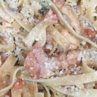 Chicken Alfredo · Tender Marinated Chicken Breast with Our creamy alfredo Sauce and shaved Parmesan cheese. Wi...