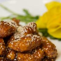 Sesame Chicken · Tender marinated chicken sautéed till crispy outside, cook in our specialties sauce and top ...