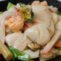 Happy Family · Fresh shrimp, scallops, beef and chicken sautéed with fresh vegetable flavored with brown sa...