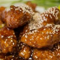 Sesame Chicken · Tender marinated chicken sautéed till crispy outside, cook in our specialties sauce and top ...
