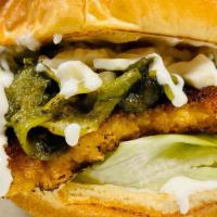 Chicken Rajas Burger · Buffalo panko-breaded chicken, topped with our signature rajas (roasted poblano pepper, roas...
