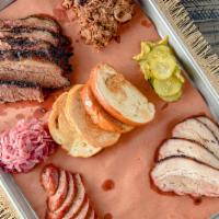 Grand Slam · A selection of a half pound of 4 smoked meats, totaling 2 lbs of meat! Served with 4 large (...