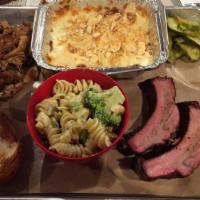 Double Platter · Sampler platter of a quarter pound each of your choice of two smoked meats, served with your...