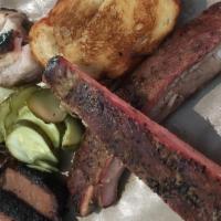 Triple · Sampler platter of a quarter pound each of your choice of three smoked meats, served with yo...