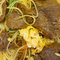 Gluten Free Singapore Rice Noodle With Beef  · Stir fried thin rice noodles with beef, egg, onion, carrot, bean sprout and green pepper in ...