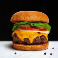 Charlie'S Cheese Burger · American beef patty topped with melted cheese, lettuce, tomato, onion, and pickles. Served o...