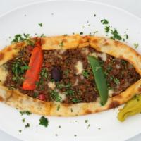 Kiymali Pide (Ground Meat) 	Nf · A thin dough crust stuffed with seasoned ground and beef, onions, red and green bell peppers