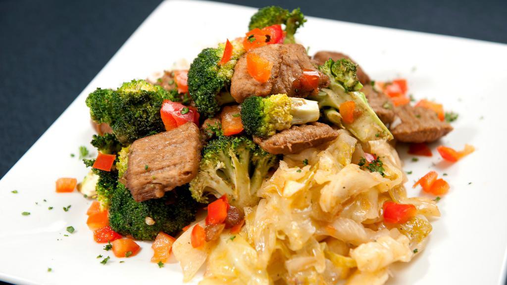 Beef And Broccoli (Vegan) · Sauteed vegan beef tips and broccoli. Served with rice and cabbage.