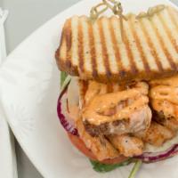 Grilled Salmon And Shrimp Sandwich · Salmon and shrimp, spinach, tomatoes, onion, Old Bay, provolone cheese, spinach cheese spread.