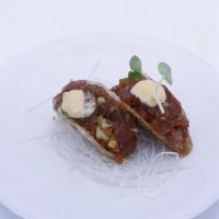 Tuna Taco (2 Pieces) · Ahi tuna served in a crispy taco shell topped with masago, green onion, eel sauce, anticucho...