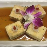 Agedashi Tofu · Fried tofu, tempura sauce, radish, ginger, green onion and seaweed.