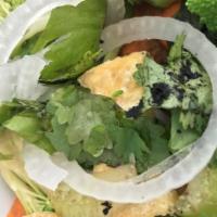 Buddha Vermicelli · Tofu, crispy veggie rolls, rice noodles, bean sprouts, lettuce, basil, radish, and carrots w...