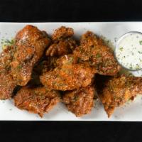 Capital Wings · Deep fried naked wings, tossed in your choice of flavor served with bleu cheese or ranch *Al...