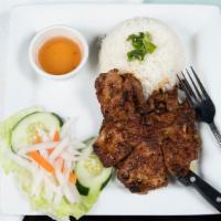 Grilled Pork Chop · Two pieces. Come with white rice, pickled carrots and daikon, and lettuce.
