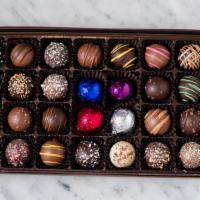 Truffles  · Assorted flavors 
Includes milk, dark and white chocolates
15 pieces