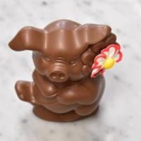 Penelope · Hollow milk chocolate pig with flower. 5 oz.