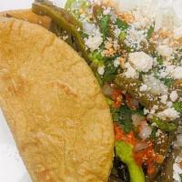 Nopales · VEGETERIAN.  Cactus sautéed in salsa macha, with . Corn, toppings : red salsa, avocado salsa...