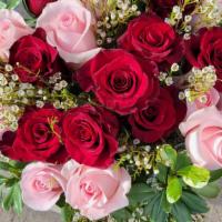 Elegant Roses · This bouquet features 12 red 12 pink  roses arranged with greens. Delivered in a clear glass...