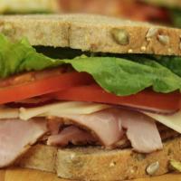 Ham & Swiss · Tender slices of honey smoked ham and Swiss cheese, topped  with thinly sliced red onion, ro...